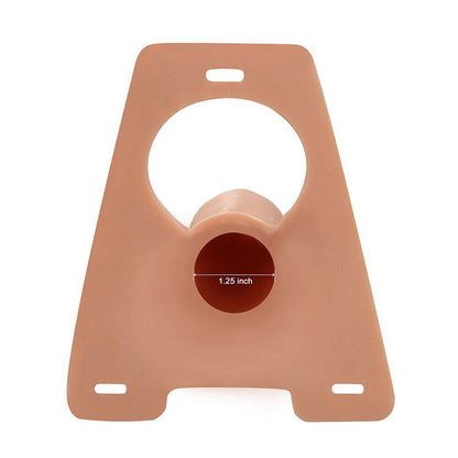 Skin-colored silicone hollow strap-on with circular cutout and measurement on a white background