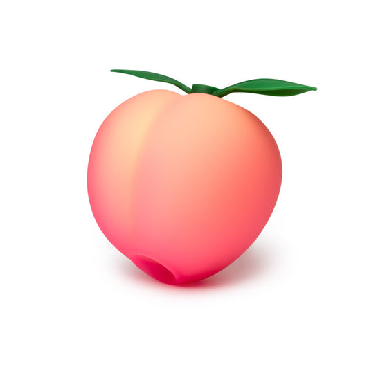 Peach shaped clitoral stimulator with a green stem on a white background