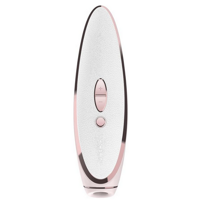 White and rose gold electronic massage device on a white background