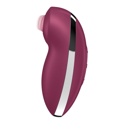 Pink handheld electronic device on a white background