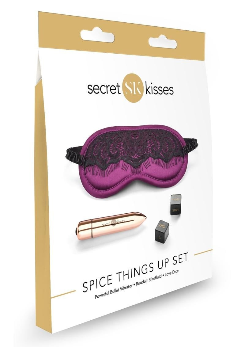 Product packaging for 'Secret Kisses' spice things up set with a purple eye mask and small items.