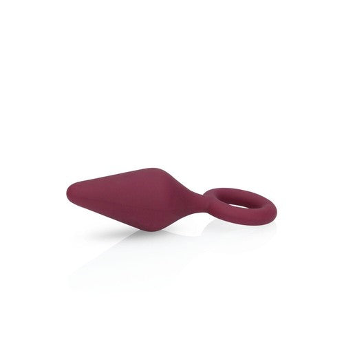 Red silicone anal plug on a white background