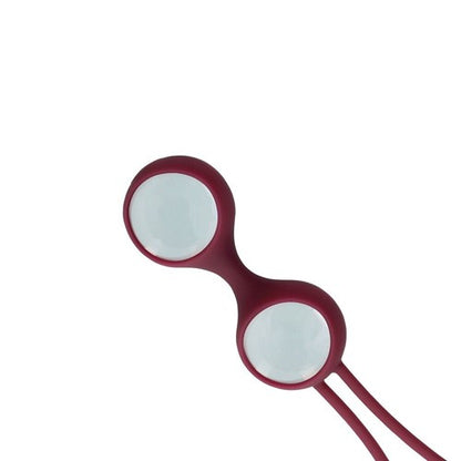 Red kegel balls with white lenses on a white background