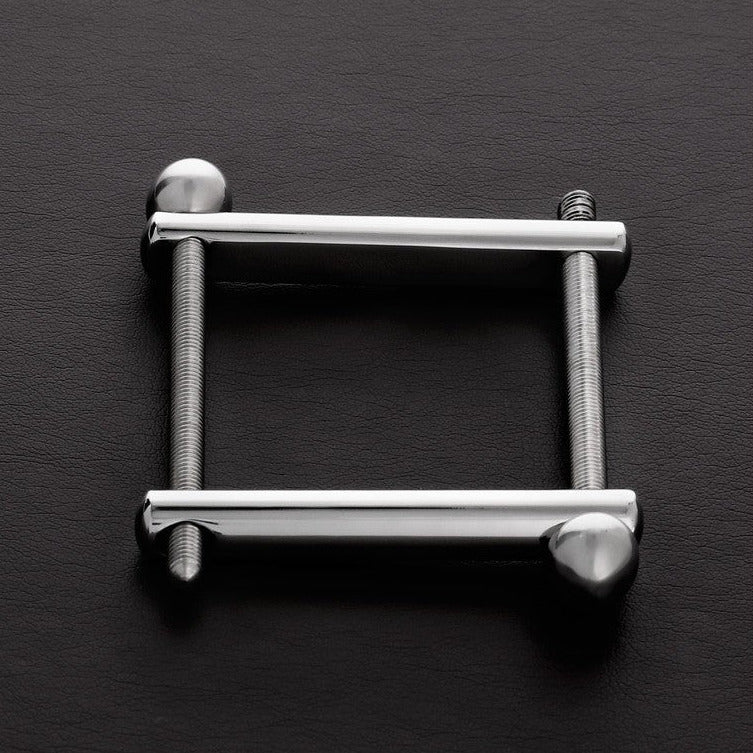Metallic square frame with cylindrical ends on a dark gray background