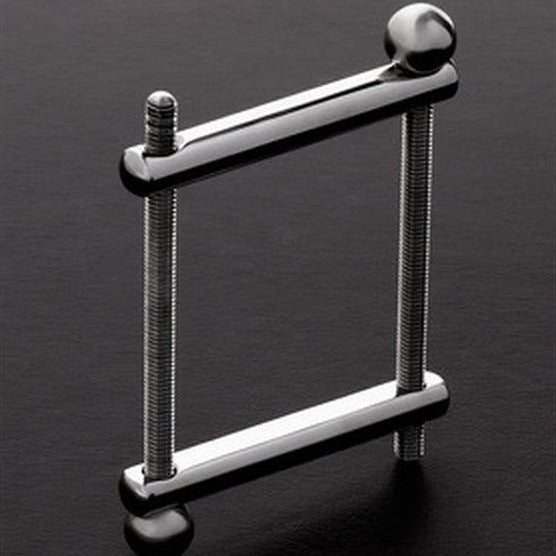 Shots Steel The Ball Crusher CBT Bondage Fetish Clamp Silver Stainless Steel on a dark background