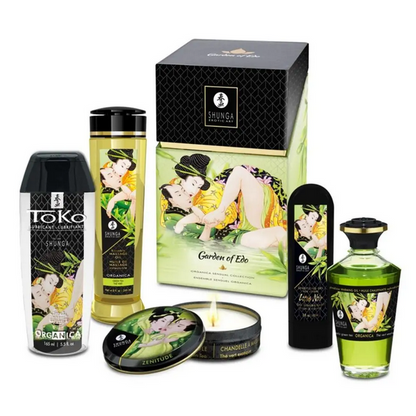 Collection of Shunga products including bottles, a box, and a candle on a white background