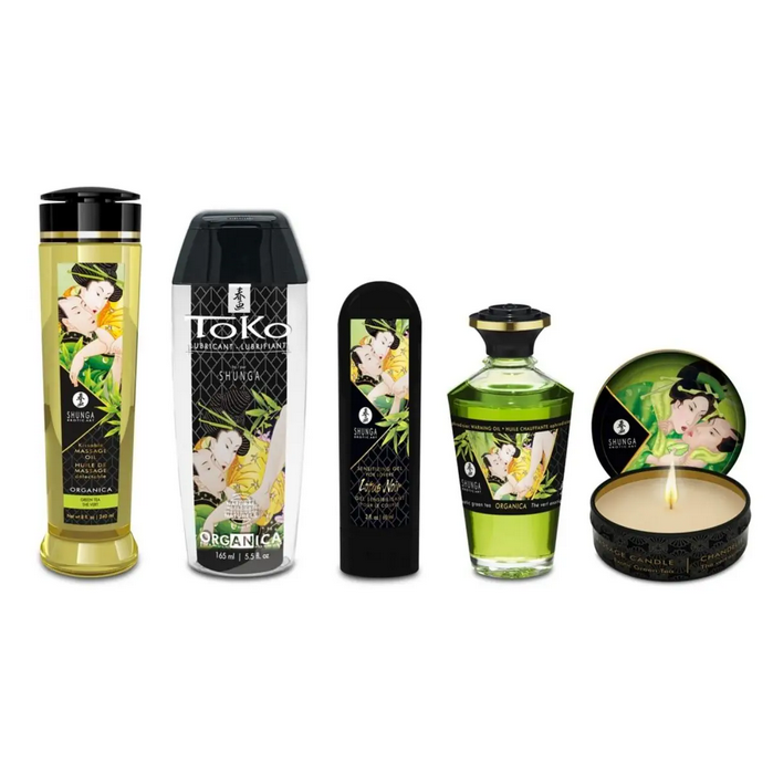 Collection of Shunga products including bottles and a candle on a white background
