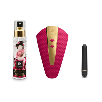 Skincare product set with a spray bottle, pink scrubber, and black applicator on a white background