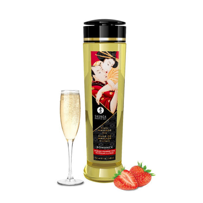 Bottle of Shunga massage oil with a glass of champagne and strawberries on a white background
