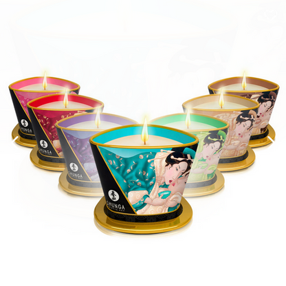 Set of candles in decorative tins with visible branding on a white background