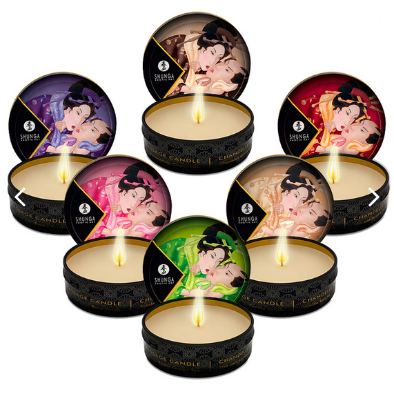 Set of Shunga candles with colorful packaging on a white background