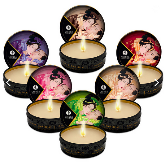 Set of Shunga candles with colorful packaging on a white background