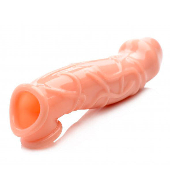Pink silicone penis extender sleeve on a white background