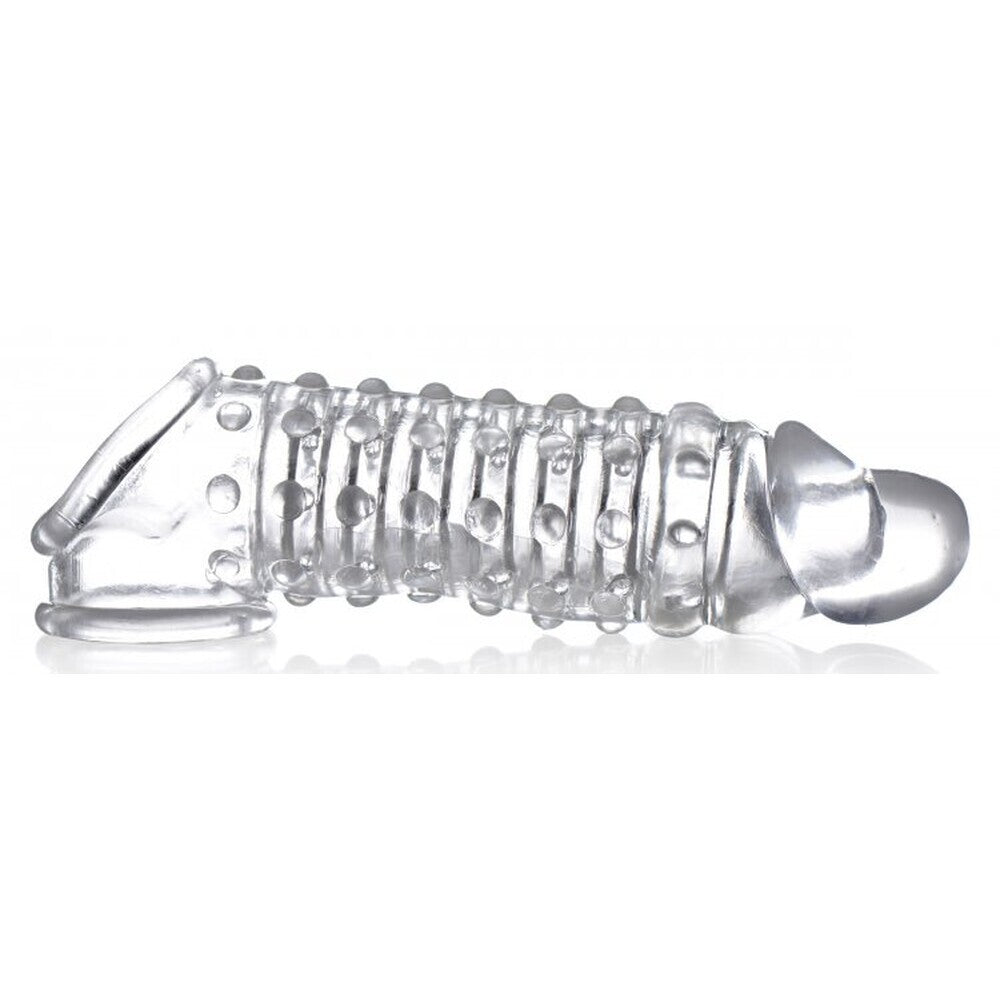 Clear silicone penis sleeve with textured design on a white background