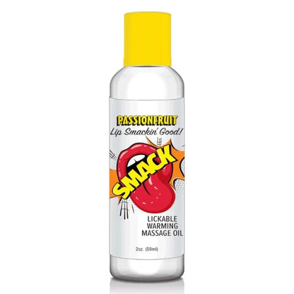 Bottle of lickable warming massage oil with a yellow cap on a white background