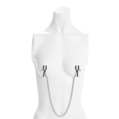 Mannequin wearing a silver chain nipple clamp on a white background