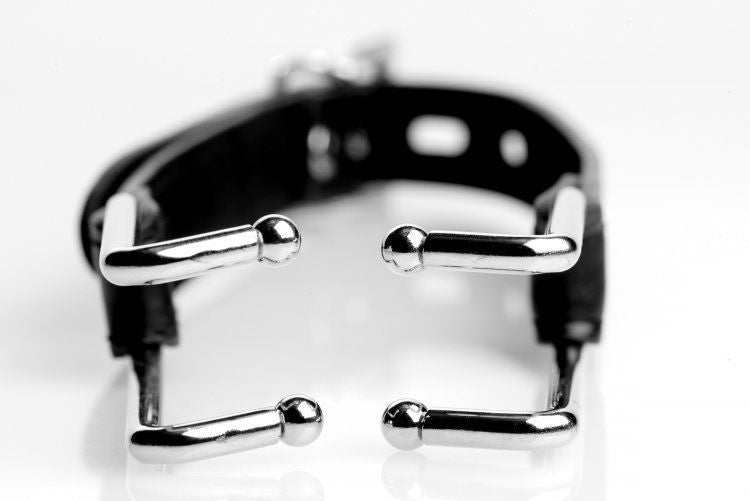 Black leather belt with silver metal hooks on a white background