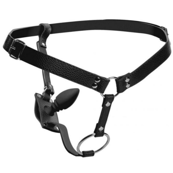 Black leather harness with metal hardware and anal plug on a white background