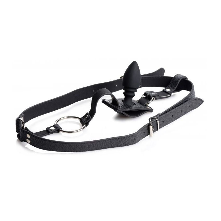 Black leather harness with anal plug attachment on a white background