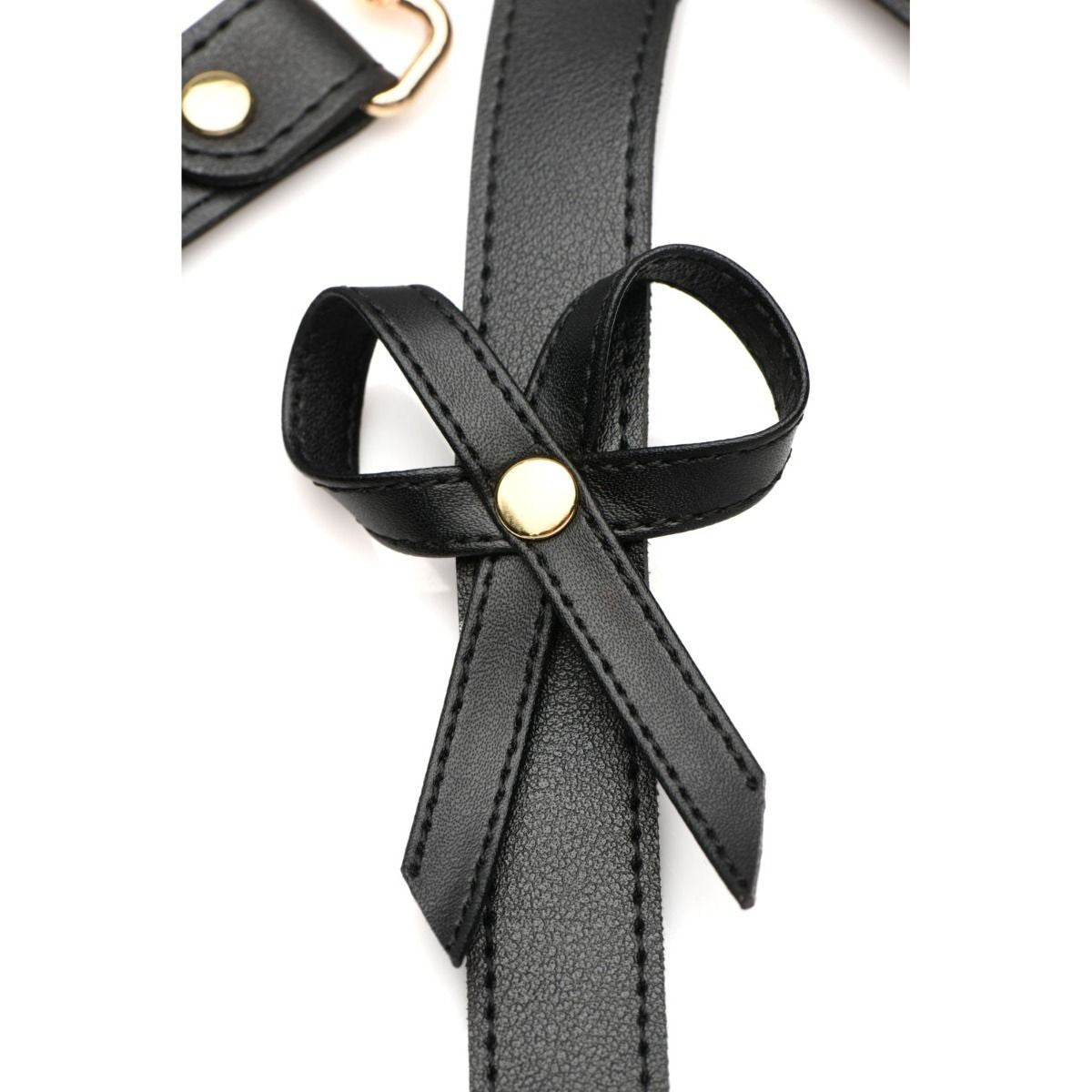 Black leather strap with a bow and gold accents on a white background