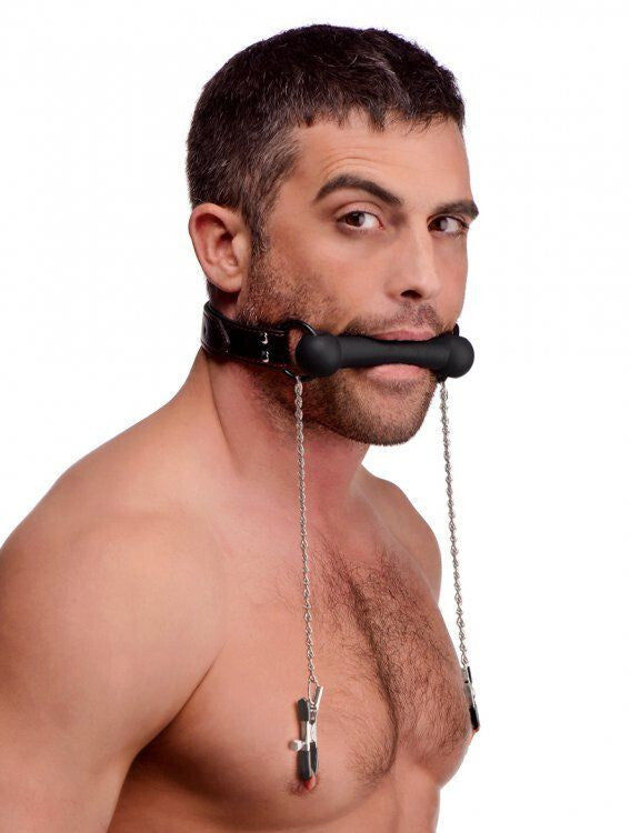 Man wearing a black muzzle with chains on a white background
