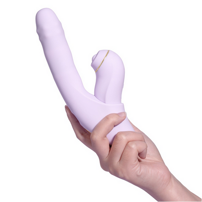 Hand holding a purple sex toy against a white background