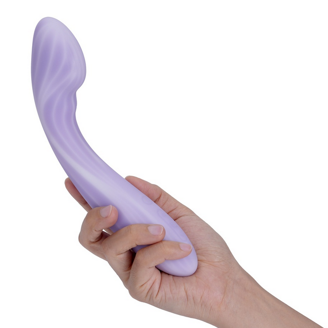 Hand holding a purple curved object against a white background