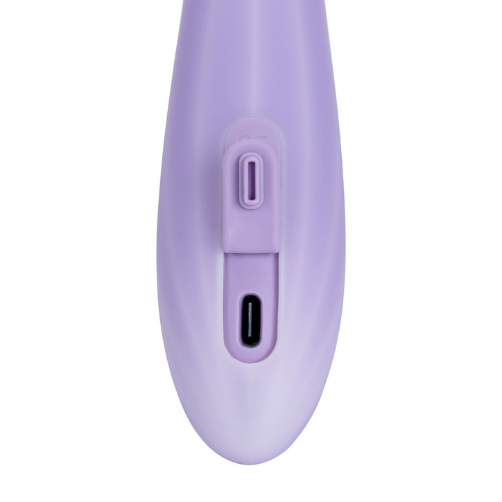 Purple electronic device with a power button and USB port on a white background