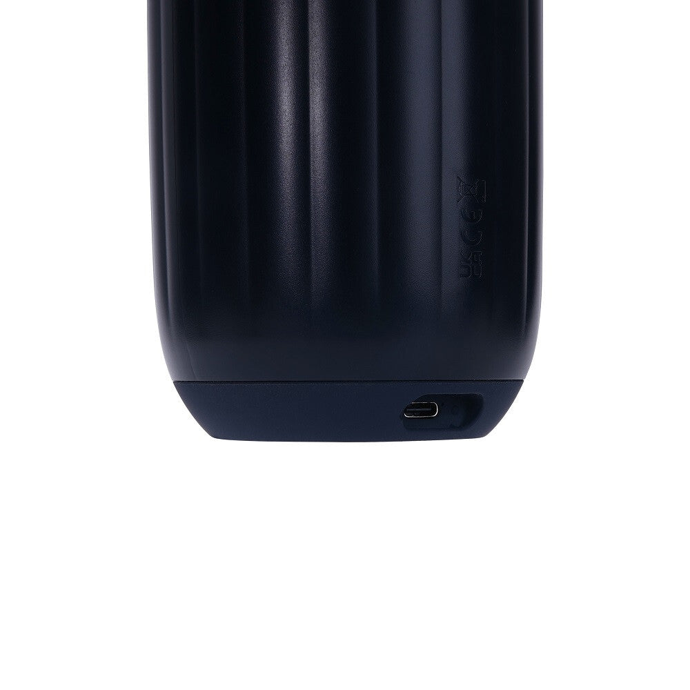 Close-up of a black electronic device with a USB-C port on a white background