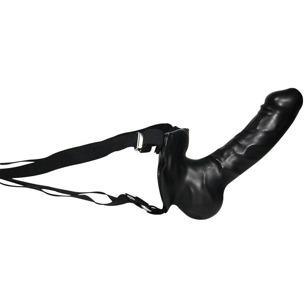Black strap-on dildo with a strap on a white background
