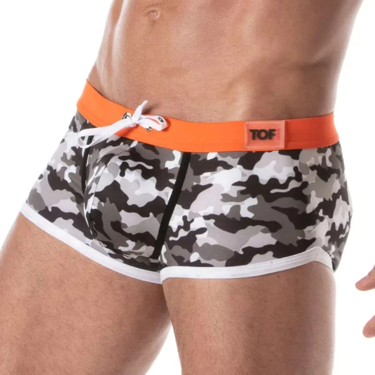 Camouflage shorts with an orange waistband on a white background
