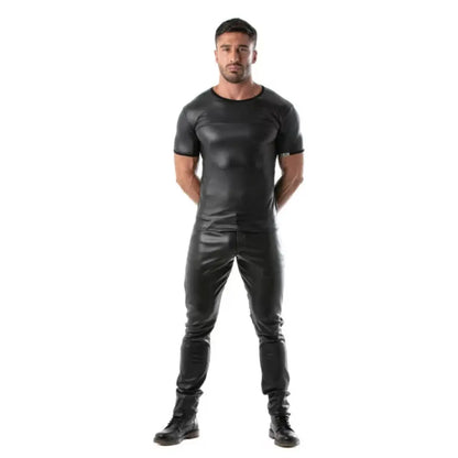 Man wearing a black leather outfit on a white background