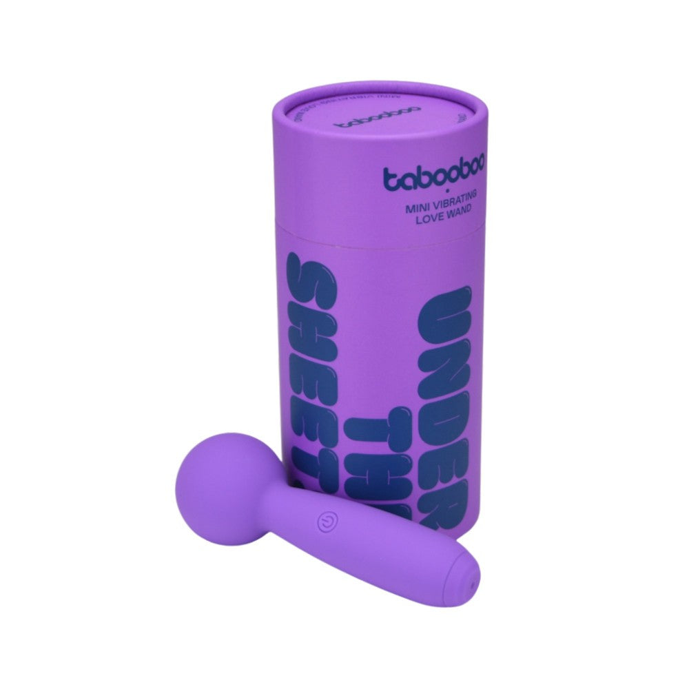 Purple mini vibrator with packaging on a white background