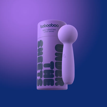Purple handheld device with packaging labeled 'tabooboo' on a gradient purple background