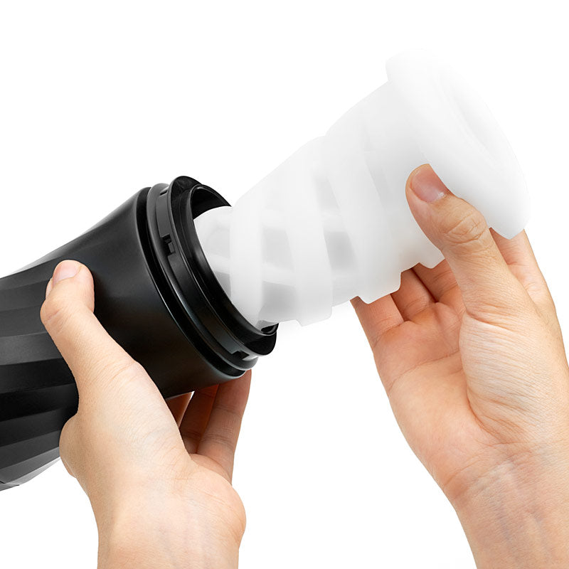 Person holding a black and white cylindrical product with a white background