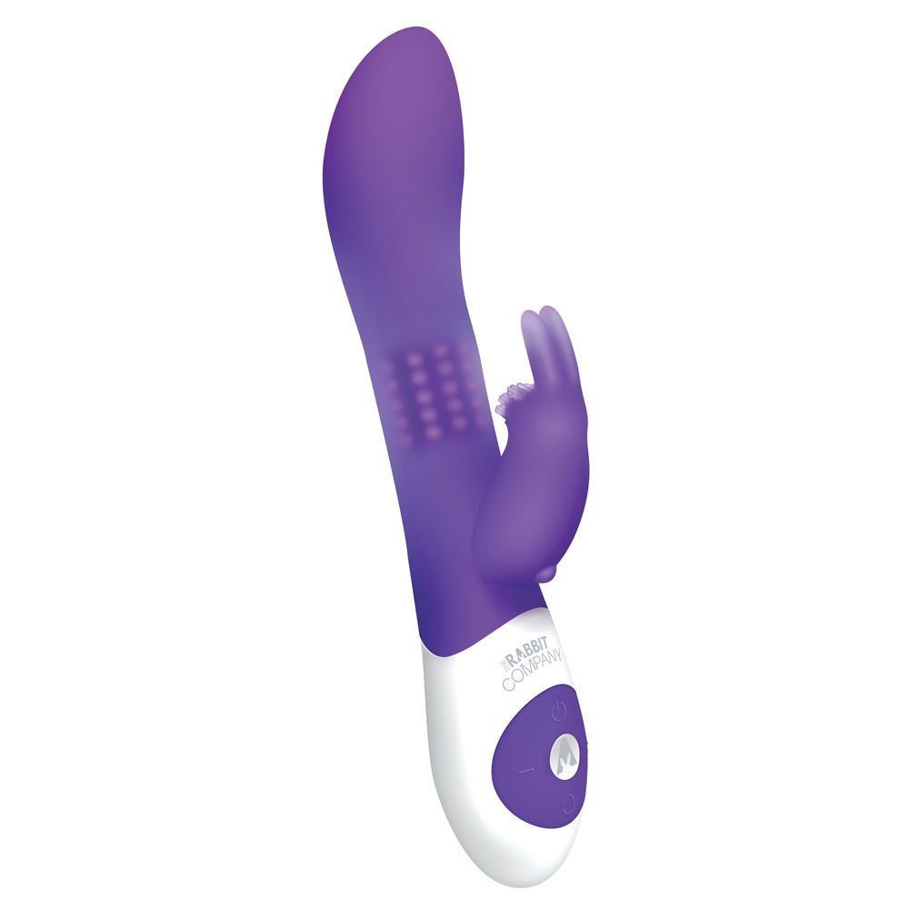Purple and white electronic massage device on a white background