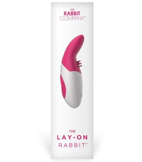 Pink and white 'The Lay-On Rabbit' product packaging from The Rabbit Company on a white background.