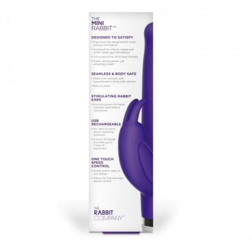 Purple sex toy with packaging on a white background