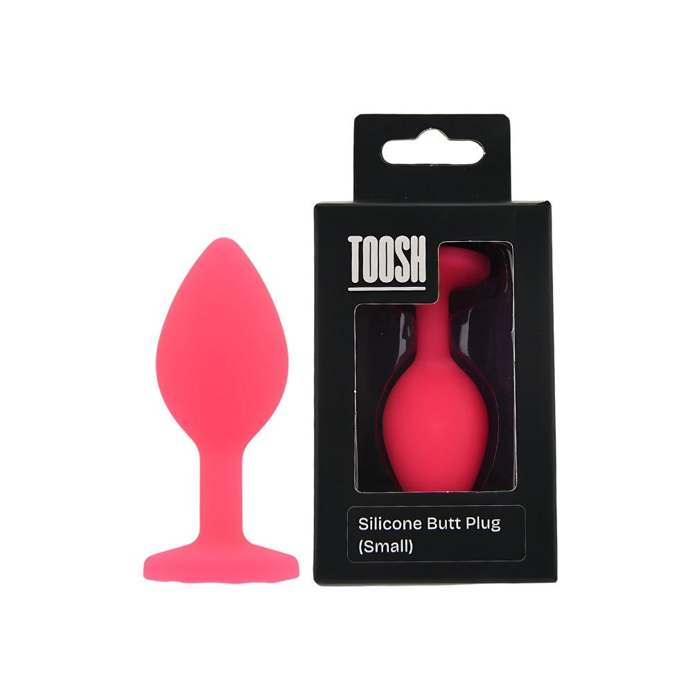 Pink silicone butt plug with packaging on a white background