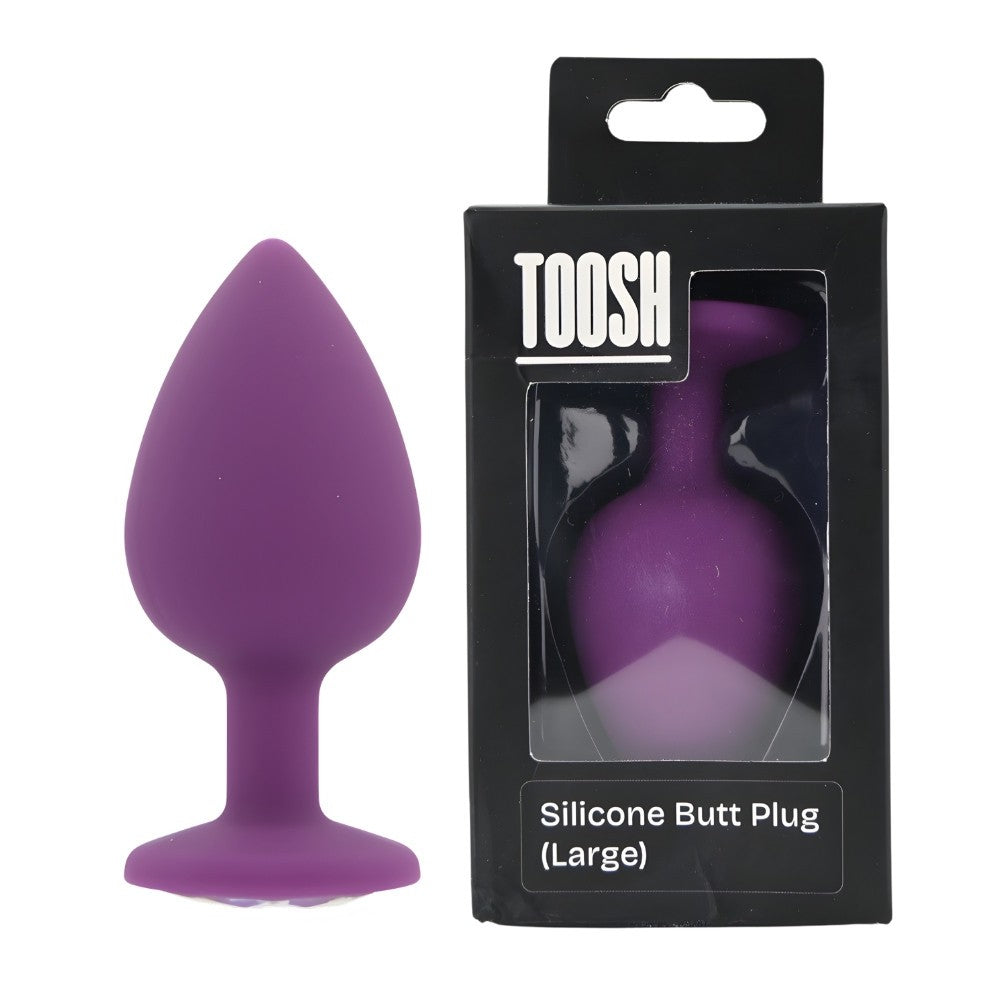 Purple silicone butt plug with packaging on a white background