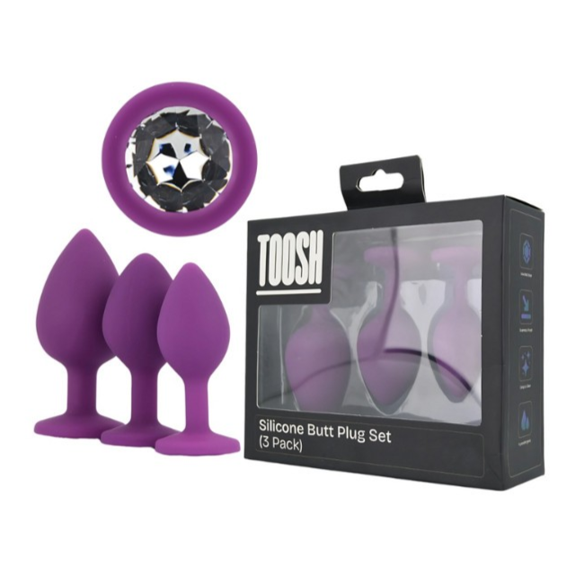 Purple silicone butt plug set with packaging on a white background