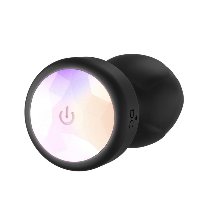 Black silicone plug with power symbol on a white background
