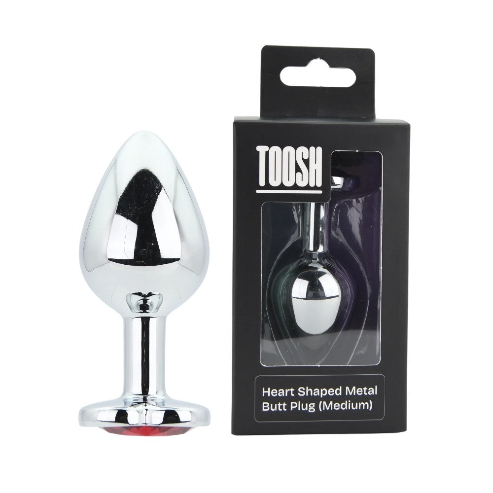 Heart-shaped metal butt plug with packaging on a white background
