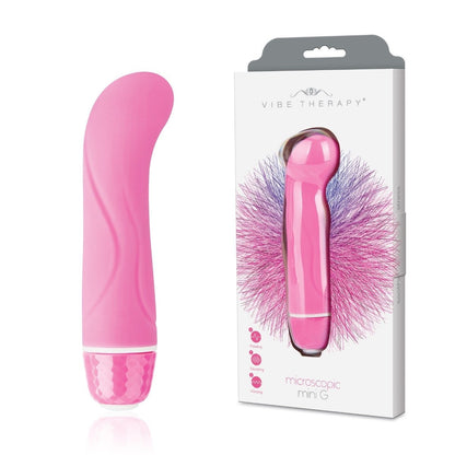 Pink handheld electronic massage device with packaging on a white background