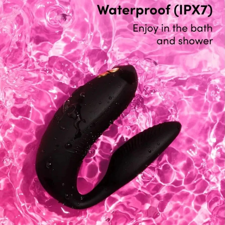 Black waterproof device on pink water background with 'Waterproof (IPX7)' text.
