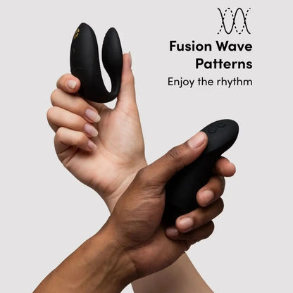 Two hands holding black electronic devices with 'Fusion Wave Patterns' branding on a light gray background.