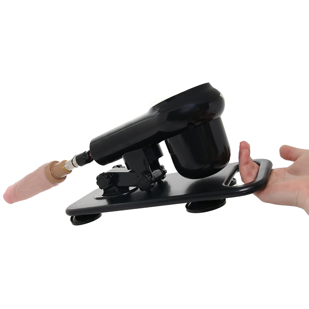 Black sex machine with pink dildo on a white background