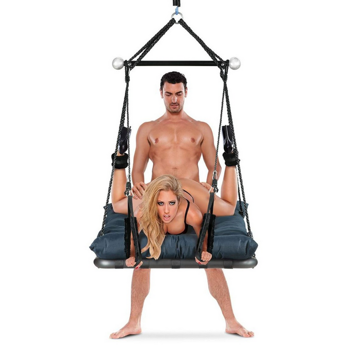 Person using a suspension sex sling swing with another person on a white background