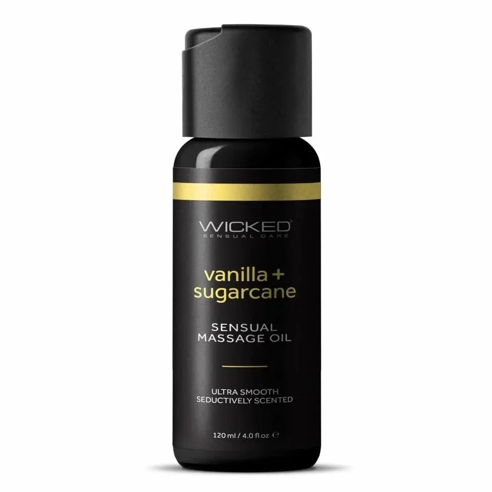 Black massage oil bottle labeled 'Wicked Sensual Care' with 'lemongrass + ginger' on a white background