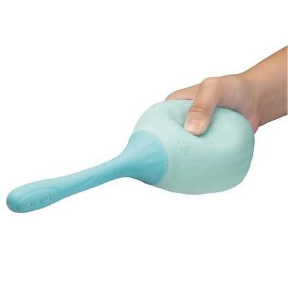 Light blue handheld anal douche held by a hand on a white background